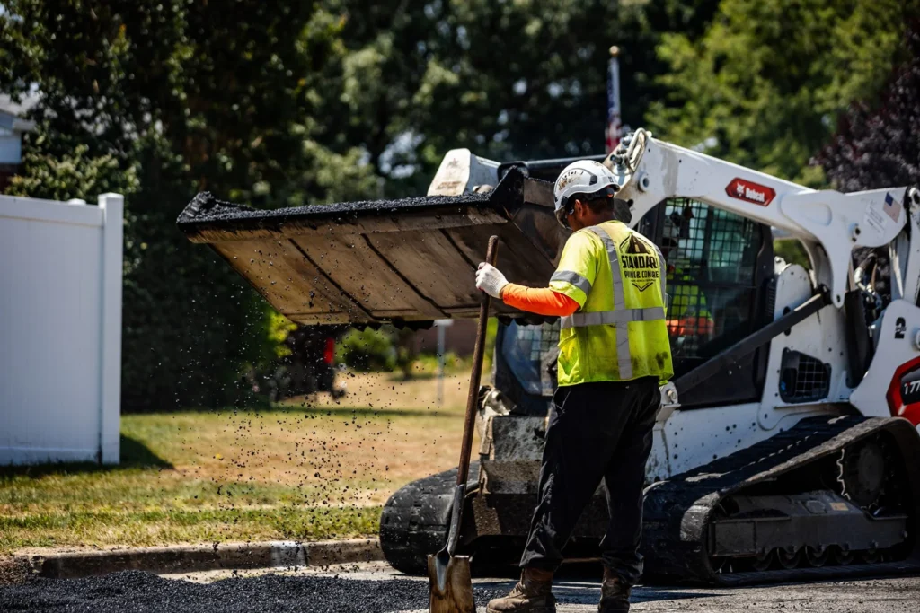 milled asphalt material being loaded into truck for recycling and reuse