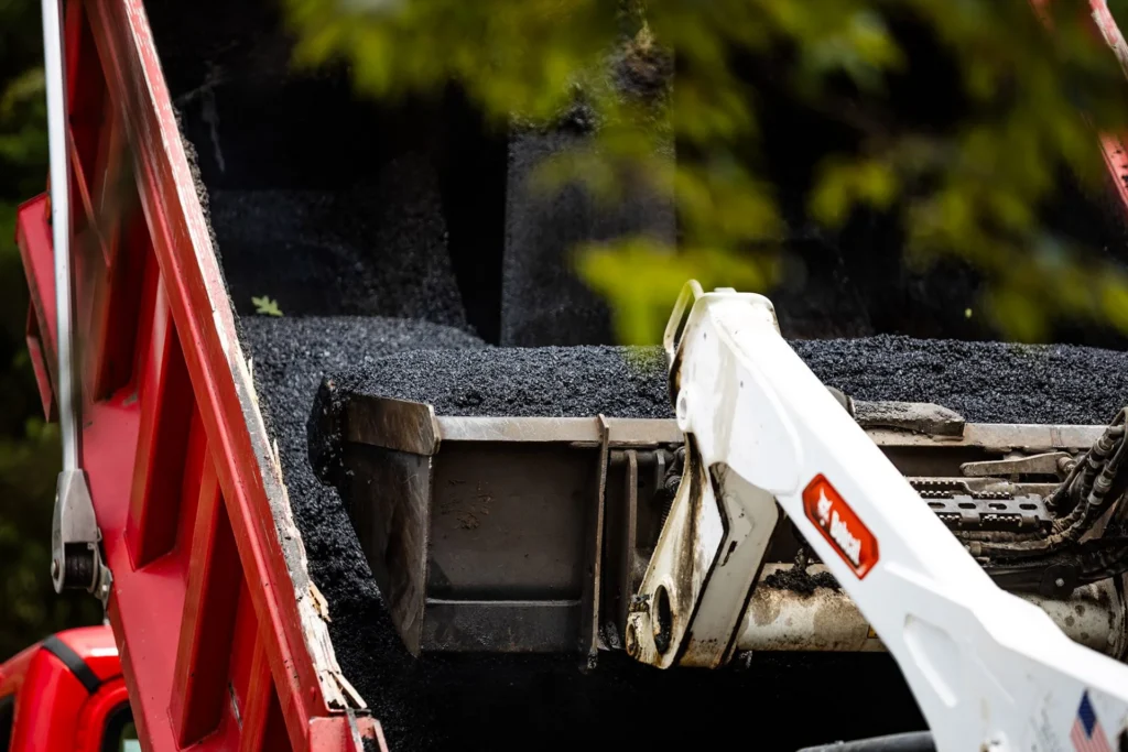 close-up of tools used for fixing asphalt surface damage and cracks