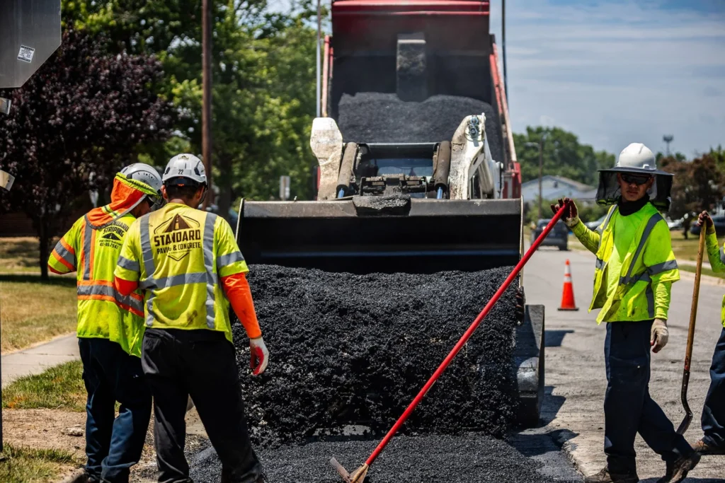 crew repairing damaged pavement surface on a commercial property in Maryland